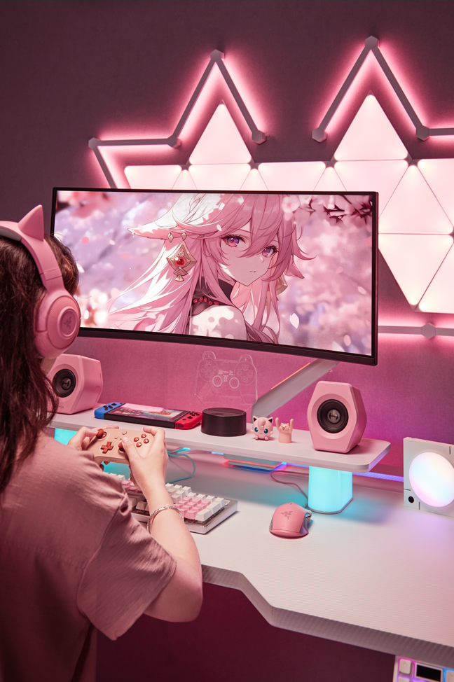 Pink gaming setup with dual monitors
